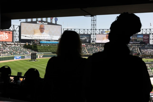 Pope Leo XIV addresses Catholic faithful on the scoreboard at Rate Field, home to the Chicago White Sox, during a celebration and Mass to honor his selection as Pope on June 14, 2025, in Chicago.