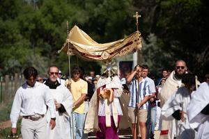 Catholics walk in solemn procession through the dusty roads surrounding St. Michael’s Mission, a site founded in 1898 under the vision of St. Katharine Drexel, as the National Eucharistic Pilgrimage makes its way through the heart of the Navajo Nation on June 12 in Arizona. The event marks a historic moment of reverence and unity, as the Blessed Sacrament is carried through one of the most spiritually rich yet often overlooked regions in the American Church.