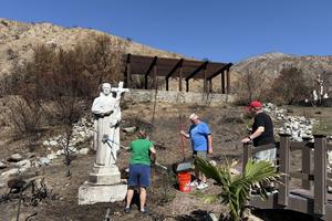 Volunteers help clean up the prayer garden at Mater Dolorosa Passionist Retreat Center in Sierra Madre, California.