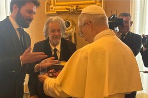 Actor Al Pacino and Italian film producer Andrea Iervolino give Pope Leo XIV a miniature model of a Maserati car during a private audience at the Vatican on June 17, 2025.