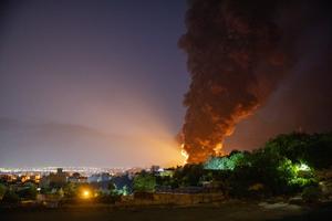 Fire and smoke rise into the sky after an Israeli attack on the Shahran oil depot on June 15, 2025, in Tehran, Iran. Iran's foreign minister said the country would respond decisively and proportionally to a wave of attacks that Israel launched beginning in the early hours of June 13. The attacks targeted multiple military, scientific and residential locations, as well as senior government officials. 
