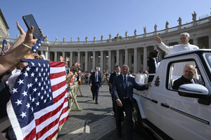 Pope Leo XIV waves as the popemobile passes by a crowd of American pilgrims gathered in St. Peter’s Square for the pope’s general audience on June 18, 2025, at the Vatican.