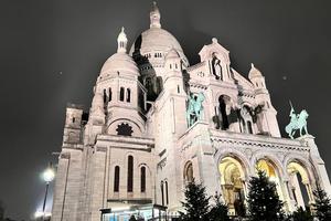 The Sacré-Cœur Basilica stands atop Montmartre hill in Paris.