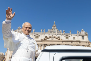 Pope Leo XIV waves from the popemobile at the crowds gathered in St. Peter's Square for Mass on Pentecost Sunday on June 8, 2025.