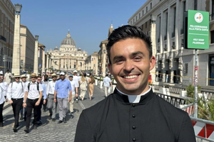 Seminarian Thomas Hammen smiles in view of St. Peter’s Basilica in Rome on Tuesday. June 24, 2025.