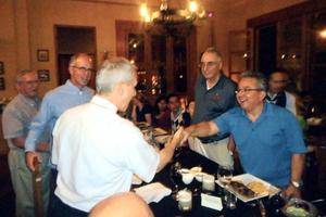 Then-Bishop Robert Prevost — now Pope Leo XIV — shakes hands with Lucho Espejo of Fargo’s Friends of Chimbote mission following a Dec. 5, 2015, beatification Mass in Peru honoring three European martyrs killed by the Shining Path. Also pictured are Father Al Bitz (now deceased), Todd Mickelson of Fargo and Pat Klein of Prior Lake, Minnesota.