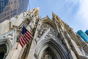 An American flag flies outside of St. Patrick’s Cathedral in New York City.