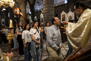 The faithful take part in the Divine Liturgy at Our Lady of the Olive Church in Damascus, Syria, on Sunday, June 29, 2025.