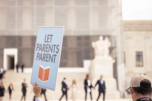 ‘Let Parents Parent’ sign is seen at a Supreme Court rally on April 22, 2025. The 6-3 decision in favor of the parents came down June 27.
