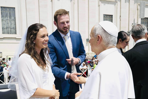 Newlyweds Anna and Cole Stevens meet Pope Leo XIV at the general audience in Rome on Wednesday, June 11, 2025.