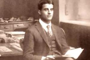 Pier Giorgio Frassati holds a book in his father’s office in 1920.