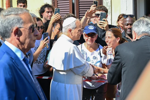 Pope Leo XIV greets people as he arrives for a two-week stay in the summer papal estate in Castel Gandolfo, southeast of Rome, on July 6, 2025. 
