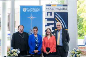 (Left to right) Bishop Dennis Walsh of Davenport, Iowa; St. Ambrose University President Amy Novak; Mount Mercy University President Todd Olson; and Conference for Mercy Higher Education Executive Director Julia Cavallo at the June 27, 2025, Milestone Celebration.