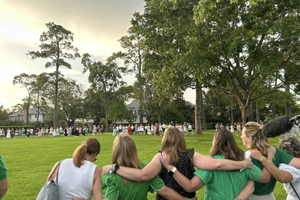 Camp Mystic alumnae sing songs after a memorial service on July 7, 2025, for the young campers who perished in floods last week.
