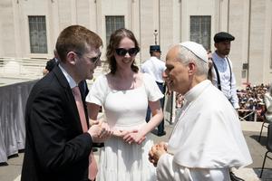 Kristen and Austin Savage speak with Pope Leo XIV during the June 11 blessing, a tradition during the papal weekly Wednesday audiences.