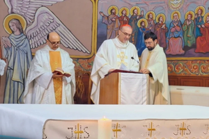 Father Gabriel Romanelli with Cardinal Pierbattista Pizzaballa, Latin Patriarch of Jerusalem, celebrating Christmas Mass at Holy Family Parish in Gaza, in December 2024.