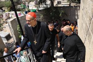 Latin Patriarch of Jerusalem Cardinal Pierbattista Pizzaballa (l) and others visit St. Porphyrius Church in Gaza City on July 18, 2025. 