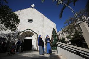 Religious sisters gather at Gaza’s Holy Family Catholic Church on Dec. 19, 2021. The church was struck by an Israeli attack on July 17.