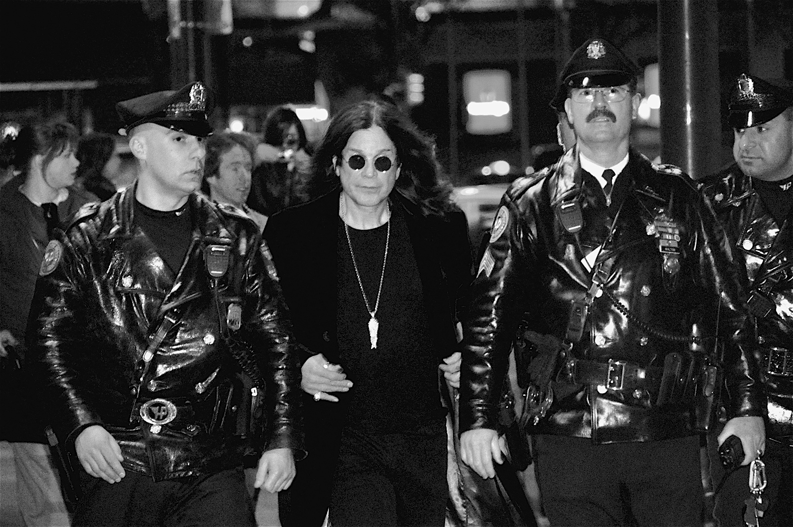 Osbourne, flanked by Philadelphia Police Department officers, leaves Borders in Center City after signing copies of I Am Ozzy, his autobiography, in January 2010.