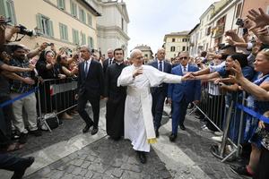 Pope Leo greets the faithful in the streets July 13, 2025, outside of the Pontifical Parish of St. Thomas of Villanova.