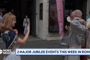 A jubilee attendee snaps a shot of a fellow jubilee-goer in Rome during a broadcast of “EWTN News Nightly,” Monday, July 28, 2025.