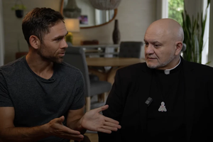 Ryan Bethea (left) and Father Carlos Martins (right), co-hosts of “The Exorcist Files” podcast.