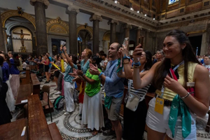Young people raise their voices from the Basilica of Santa Maria in Trastevere on Aug. 1, 2025.