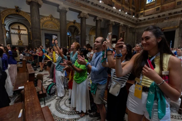 Young people raise their voices from the Basilica of Santa Maria in Trastevere on Aug. 1, 2025.