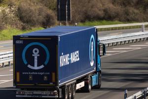 A Kühne + Nagel truck travels along a German highway. The company operates the Belgian warehouse at the center of the USAID contraception controversy.