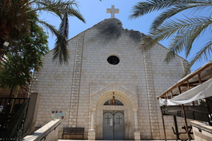 A picture shows a view of a damaged facade of the Holy Family Church on July 18, 2025, a day after it was hit in an Israeli strike in Gaza City. 