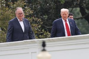 U.S. President Donald Trump takes a tour of the roof of the West Wing of the White House along with architect James McCrery (l) on Aug. 5, 2025, in Washington. 