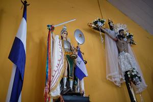 Inside the church of San Miguel, statues and a crucifix wear references to the flag of Nicaragua, symbol of the protests against the government of Daniel Ortega, in Masaya, Nicaragua, on June 25, 2019.