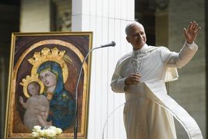 Pope Leo XIV, shown next to a Marian image, waves during the Youth Jubilee in St. Peter’s Square on July 29, 2025.