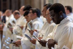 Priests pray June 27, 2025, at the Jubilee of Priests Mass with Pope Leo. 