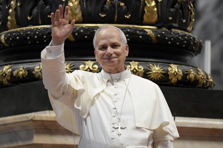 Pope Leo XIV waves to the crowd at his Wednesday general audience in St. Peter’s Basilica on Aug. 13, 2025.