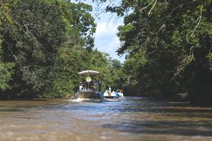 Christ is adored aboard a boat along the waterway of the Louisiana Bayou Teche, beckoning the faithful along the shores to join in prayer, on Aug. 15, 2025. Another boat carries a statue of Mother Mary.