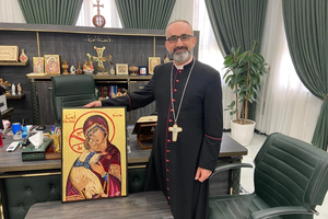 Bishop Benedictus Hanno receives  the Our Lady of Persecuted Christians icon in Qaraqosh, Iraq, on Aug. 6, 2025, from Father Benedict Kiely of Nasarean.org.