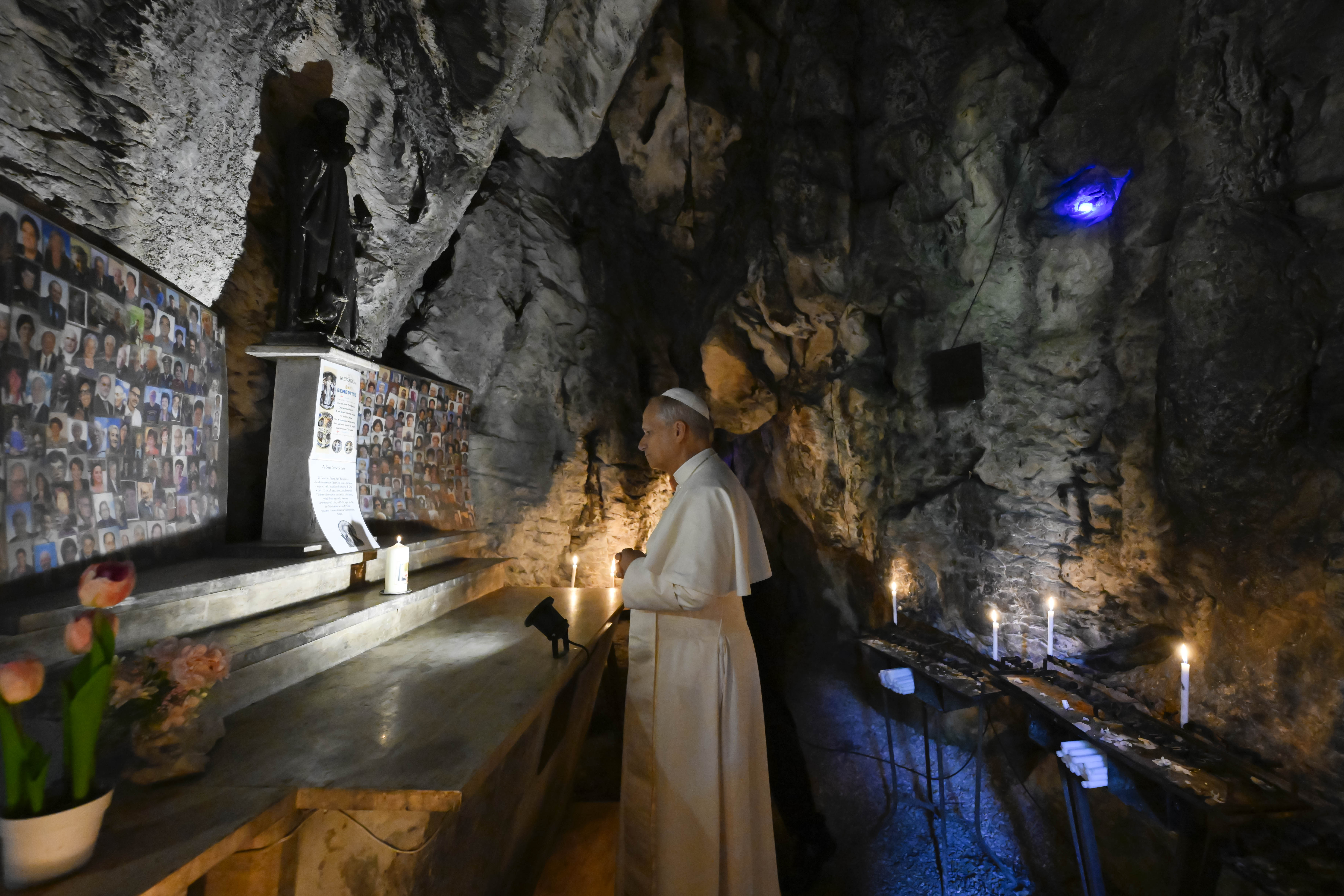 Pope Leo XIV prays in the cave at Mentorella