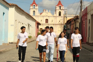 Young people walk the streets of Camagüey, Cuba.
