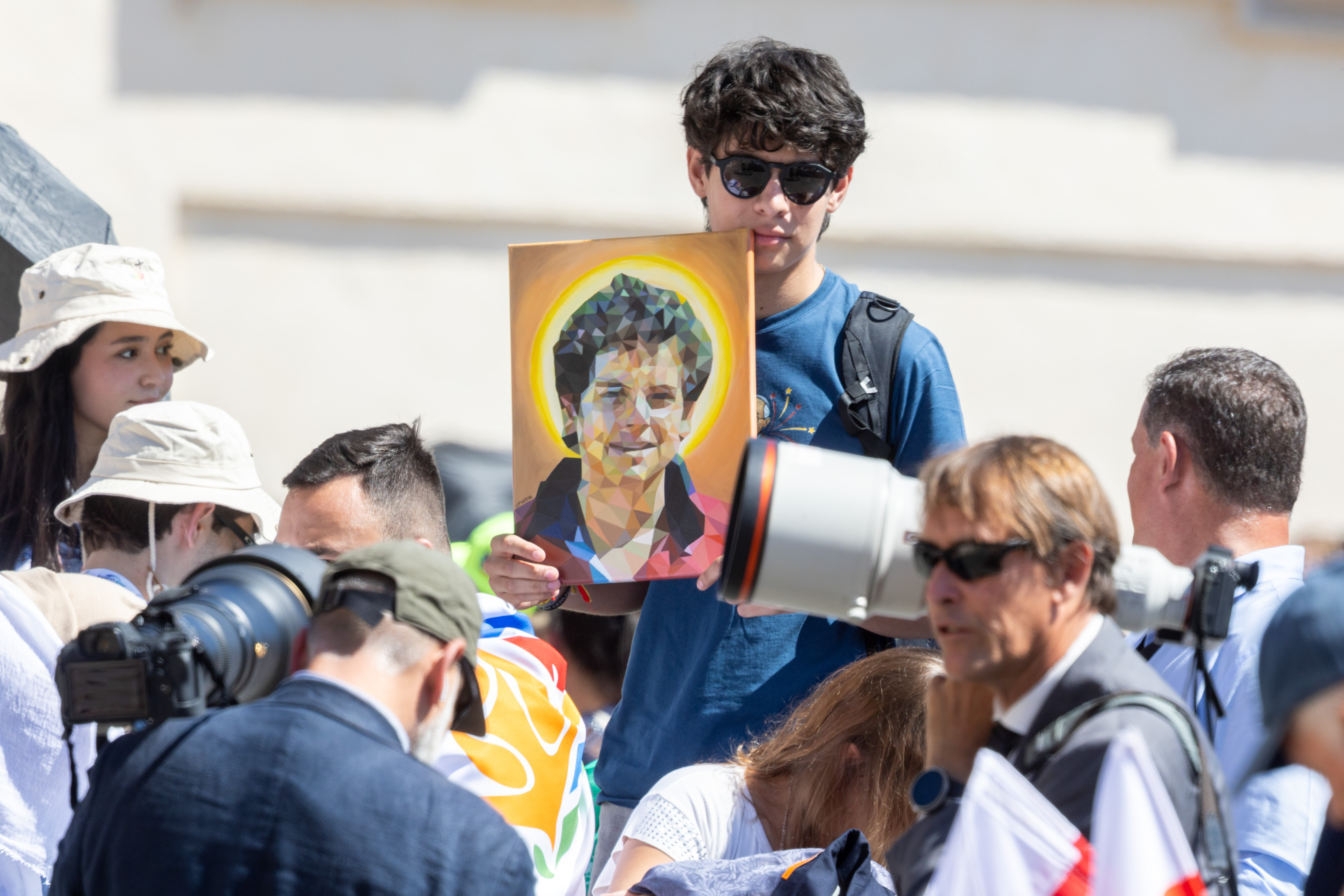 A portrait of soon-to-be-saint Carlo Acutis is held up during the General Audience with Pope Leo XIV on July 30, 2-25 in Vatican City. daniel ibanez 