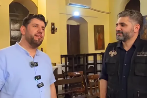 Syrian Minister of Culture Mohammed Saleh with Islamic chanter Al-Mu’tasim Billah Al-Assali inside St. Ananias Orthodix Church in Damascus, Syria. Billah Al-Assali performed an Islamic hymn with lyrics that directly contradict Christian beliefs.