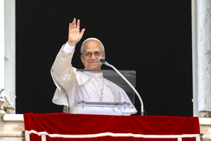 Pope Leo XIV waves to the crowd during his Angelus address on Aug. 24, 2025. 
