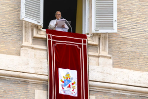 Pope Leo XIV gives his Sunday Angelus address from the Apostolic Palace overlooking St. Peter’s Square on Aug. 24, 2025, at the Vatican. 