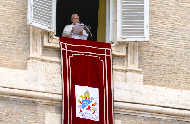 Pope Leo XIV gives his Sunday Angelus address from the Apostolic Palace overlooking St. Peter’s Square on Aug. 24, 2025, at the Vatican. 