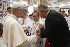 Pope Leo XIV greets French altar servers during an audience on Aug. 25, 2025, at the Vatican. 