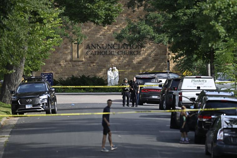 Police work the scene following a mass shooting at Annunciation Catholic Church on Aug. 27, 2025, in Minneapolis. According to Minneapolis Police, a gunman fired through the windows of the church at worshippers sitting in pews during a Catholic school Mass, killing two children and injuring at least 18 others.