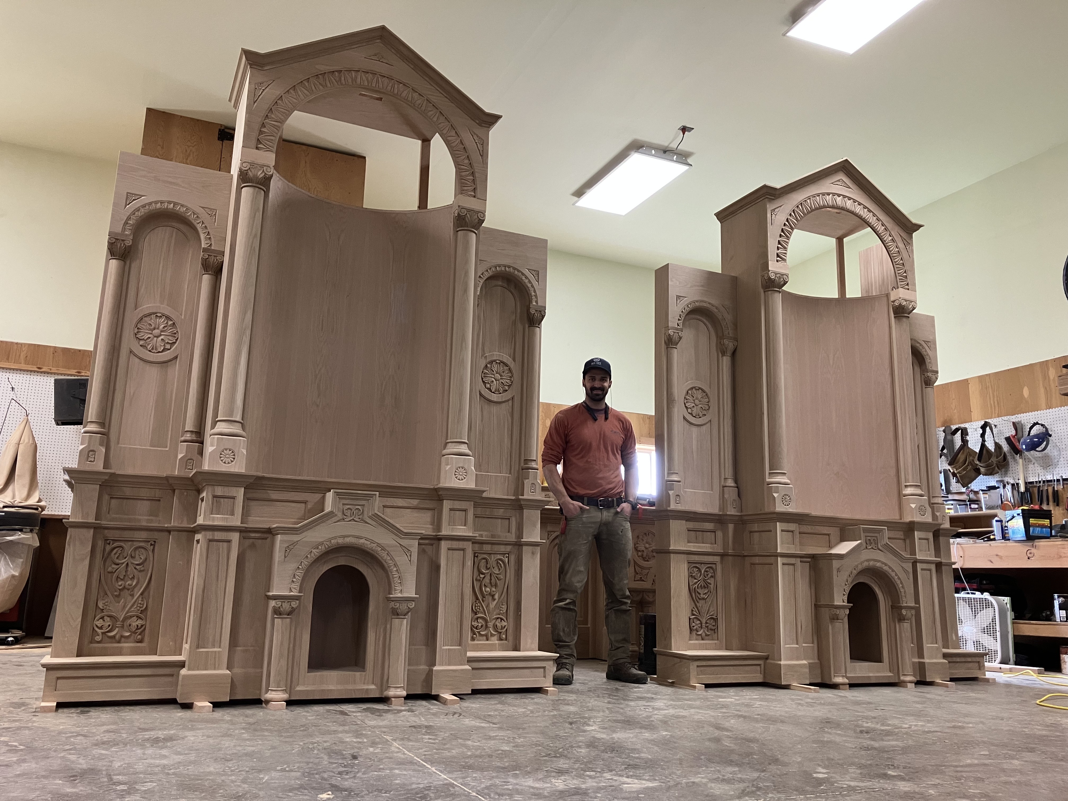 John Hayden stands between the side altars for St. Patrick’s