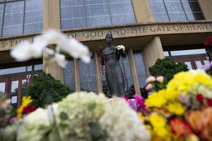 Flowers are seen outside of Annunciation Church and School on Sept. 2 in Minneapolis; on Aug. 27, a mass shooting killed two children and injured 21 others.