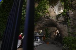 Pope Leo XIV prays at the Grotto of Lourdes in the Vatican Gardens on May 31, 2025.