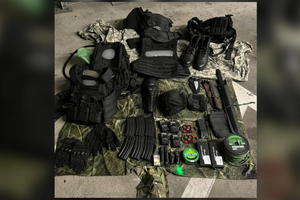 An undated police photo shows evidence allegedly recovered from Joshua Michael Richardson's car after threats police say he made against St. Michael's Abbey in Silverado, California.